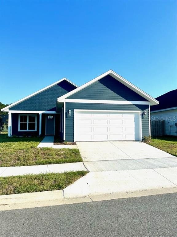 Front exterior of a new home in , Alachua, FL, highlighting curb appeal (Image 1). Front exterior of a new home in , Alachua, FL, highlighting curb appeal (Image 1).
