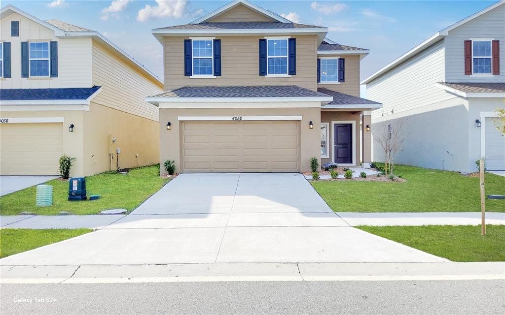 Front exterior of a new home in Harmony Central, Harmony, FL, highlighting curb appeal (Image 1). Front exterior of a new home in Harmony Central, Harmony, FL, highlighting curb appeal (Image 1).