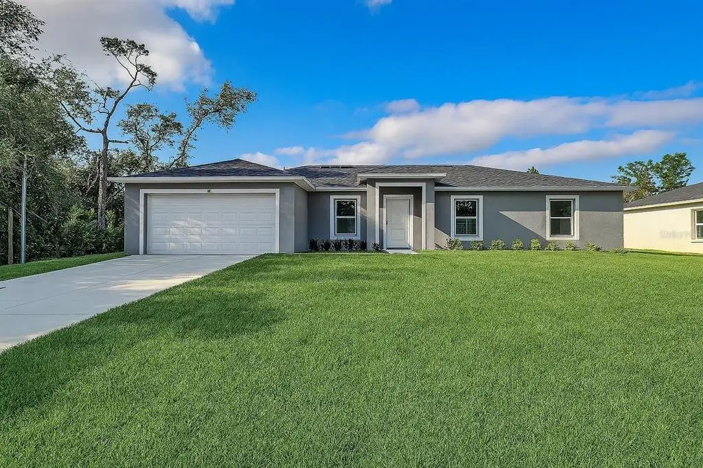 Front exterior of a new home in , Ocala, FL, highlighting curb appeal (Image 1). Front exterior of a new home in , Ocala, FL, highlighting curb appeal (Image 1).