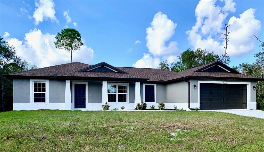 Front exterior of a new home in , North Port, FL, highlighting curb appeal (Image 1). Front exterior of a new home in , North Port, FL, highlighting curb appeal (Image 1).