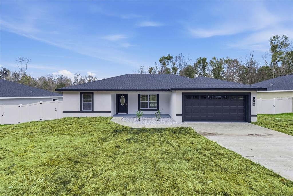 Front exterior of a new home in , Ocala, FL, highlighting curb appeal (Image 1). Front exterior of a new home in , Ocala, FL, highlighting curb appeal (Image 1).