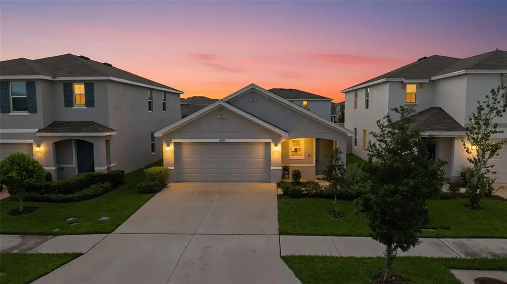Front exterior of a new home in Northwater at Two Rivers, Zephyrhills, FL, highlighting curb appeal (Image 1). Front exterior of a new home in Northwater at Two Rivers, Zephyrhills, FL, highlighting curb appeal (Image 1).