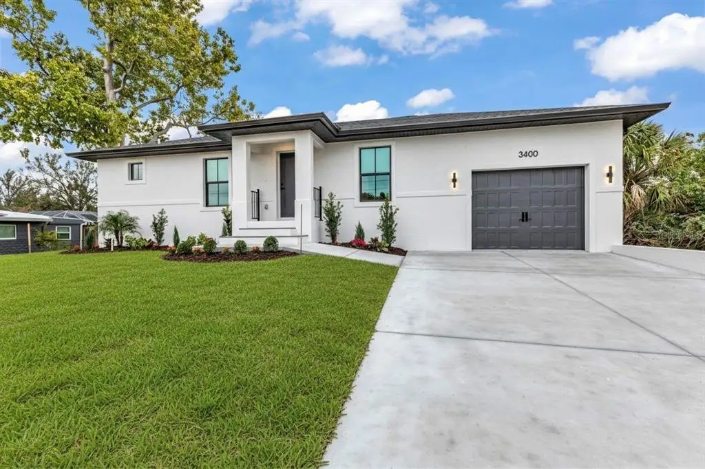 Front exterior of a new home in , Punta Gorda, FL, highlighting curb appeal (Image 1). Front exterior of a new home in , Punta Gorda, FL, highlighting curb appeal (Image 1).