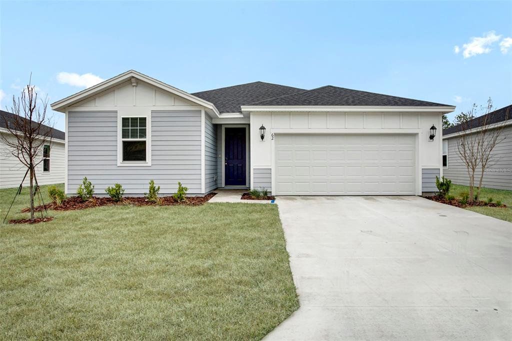 Front exterior of a new home in , Palm Coast, FL, highlighting curb appeal (Image 1). Front exterior of a new home in , Palm Coast, FL, highlighting curb appeal (Image 1).