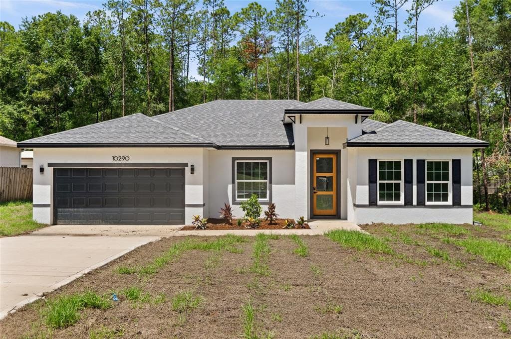 Front exterior of a new home in , Citrus Springs, FL, highlighting curb appeal (Image 1). Front exterior of a new home in , Citrus Springs, FL, highlighting curb appeal (Image 1).