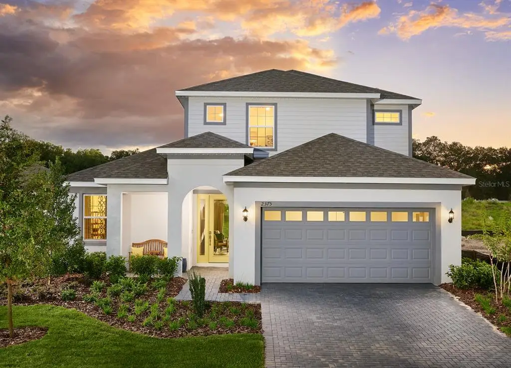 Front exterior of a new home in Summerbrooke, Mount Dora, FL, highlighting curb appeal (Image 1). Front exterior of a new home in Summerbrooke, Mount Dora, FL, highlighting curb appeal (Image 1).