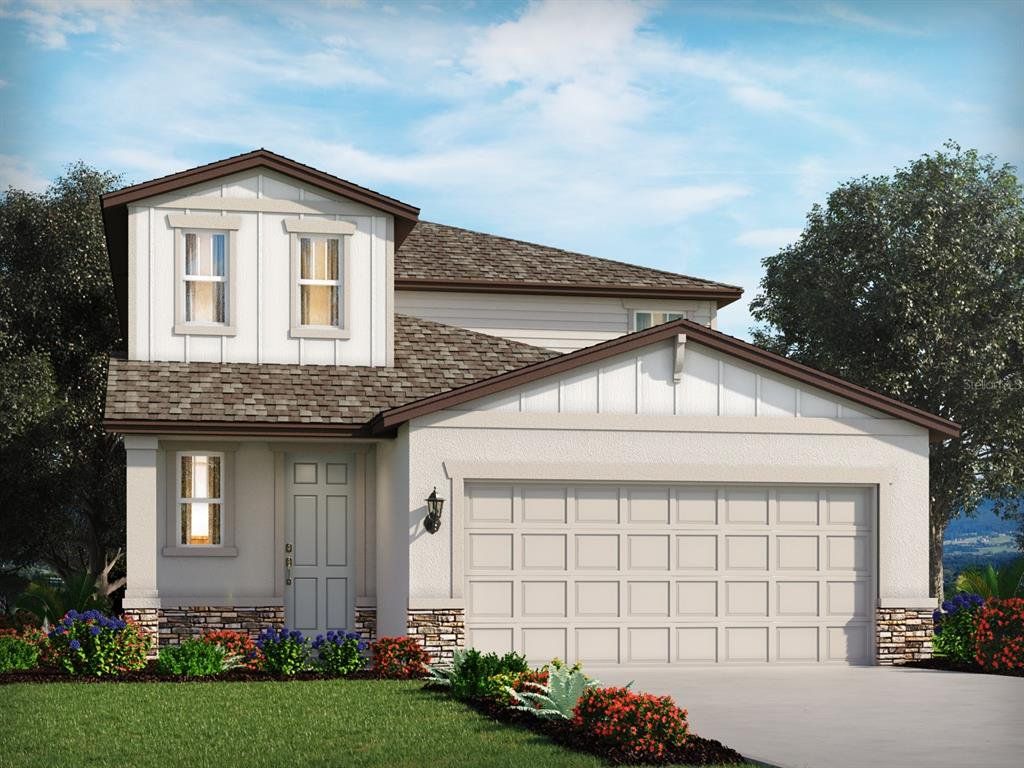 Front exterior of a new home in The Grove at Stuart Crossing - Premier Series, Bartow, FL, highlighting curb appeal (Image 1).