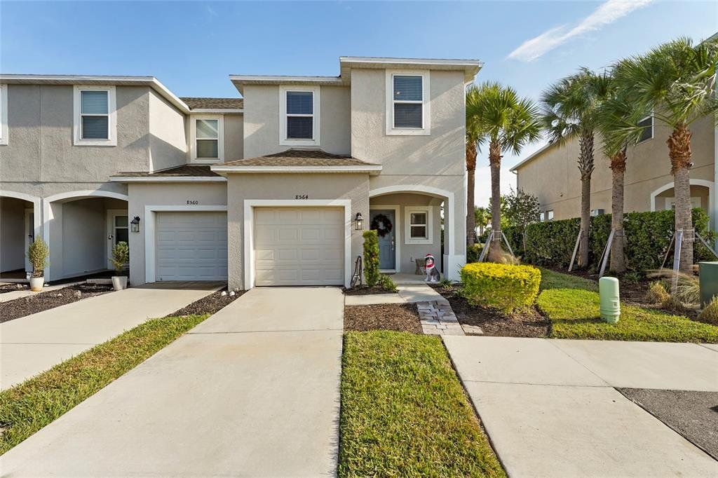 Front exterior of a new home in , Sarasota, FL, highlighting curb appeal (Image 1). Front exterior of a new home in , Sarasota, FL, highlighting curb appeal (Image 1).