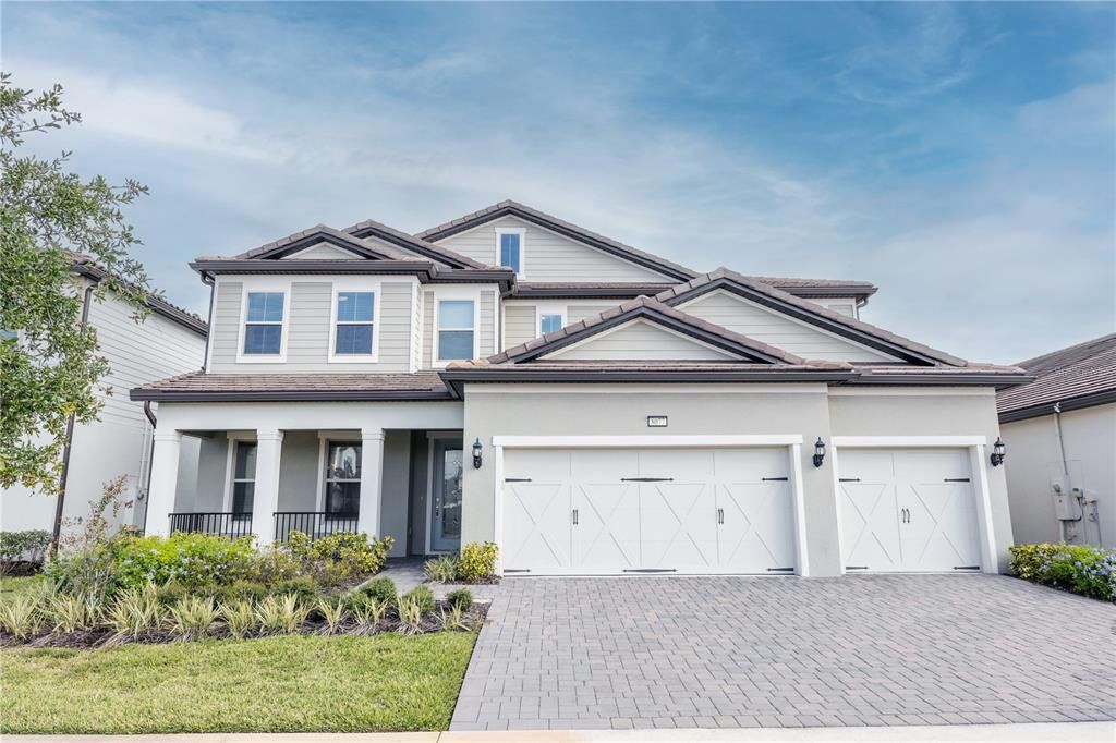 Front exterior of a new home in Phillips Grove, Orlando, FL, highlighting curb appeal (Image 1). Front exterior of a new home in Phillips Grove, Orlando, FL, highlighting curb appeal (Image 1).