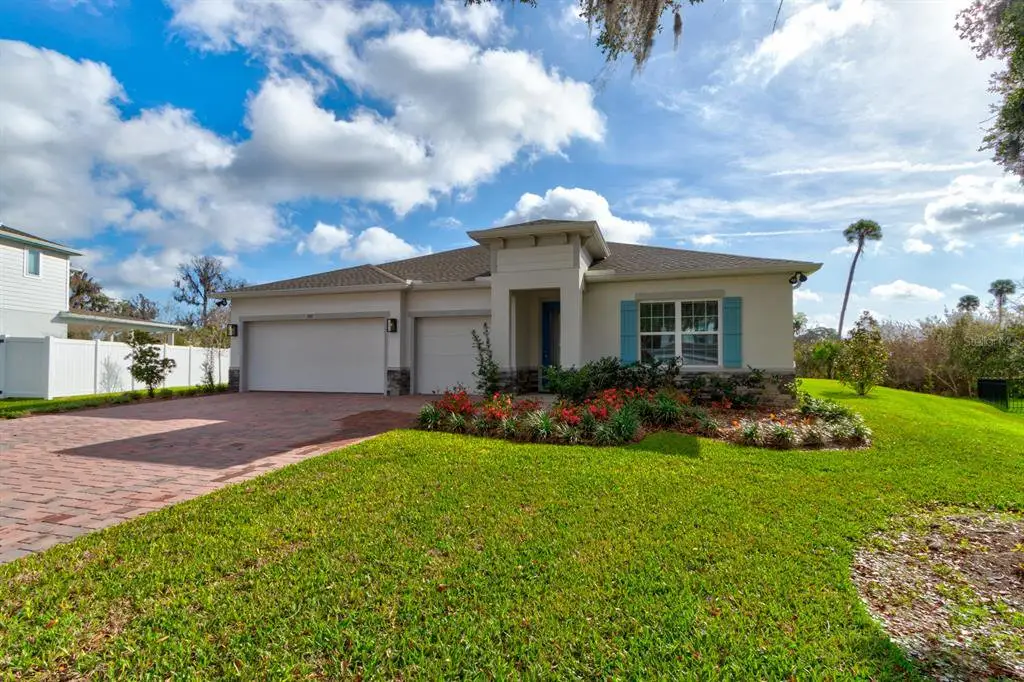 Front exterior of a new home in Copper Creek, New Smyrna Beach, FL, highlighting curb appeal (Image 1). Front exterior of a new home in Copper Creek, New Smyrna Beach, FL, highlighting curb appeal (Image 1).
