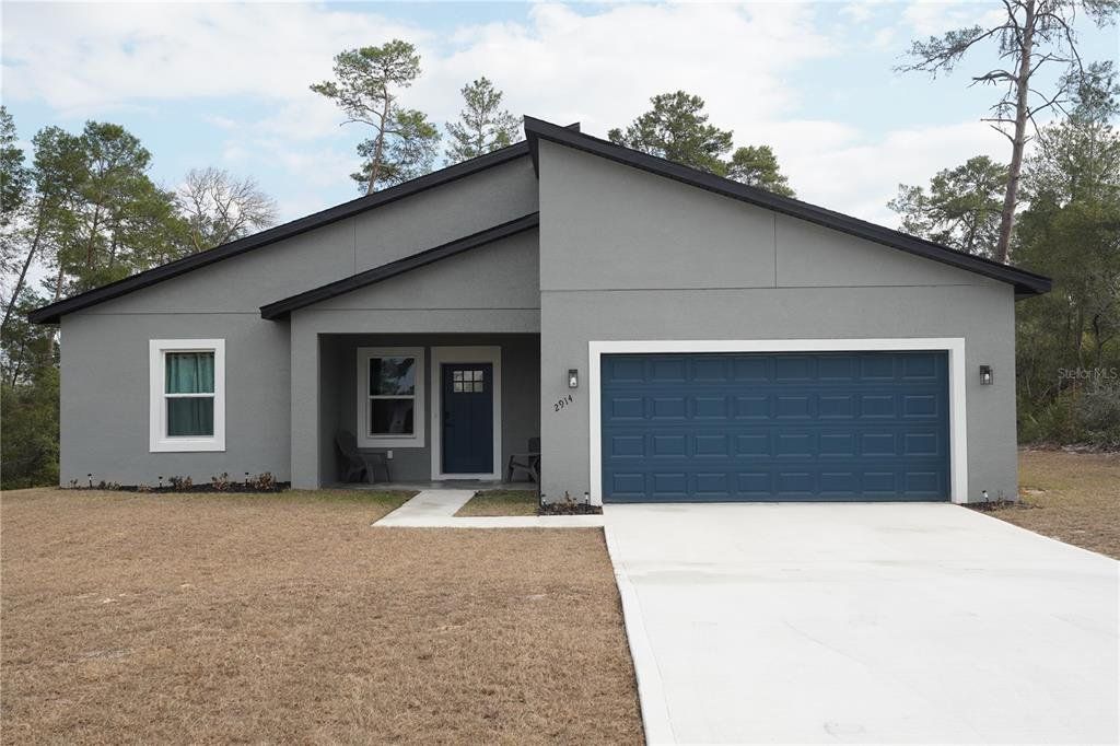 Front exterior of a new home in , Ocala, FL, highlighting curb appeal (Image 1). Front exterior of a new home in , Ocala, FL, highlighting curb appeal (Image 1).