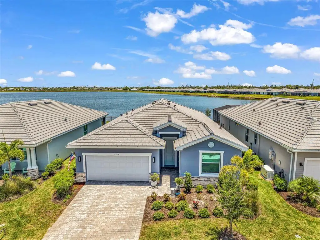 Front exterior of a new home in , Englewood, FL, highlighting curb appeal (Image 1). Front exterior of a new home in , Englewood, FL, highlighting curb appeal (Image 1).