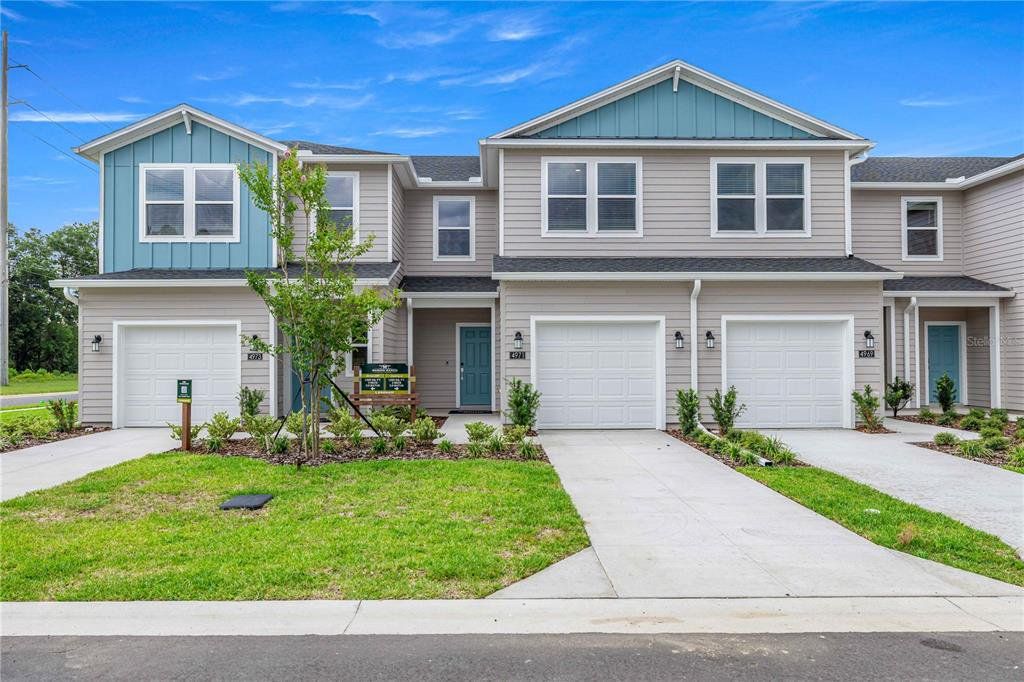 Front exterior of a new home in , Ocala, FL, highlighting curb appeal (Image 1). Front exterior of a new home in , Ocala, FL, highlighting curb appeal (Image 1).