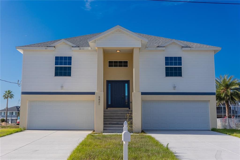 Front exterior of a new home in , Hernando Beach, FL, highlighting curb appeal (Image 1). Front exterior of a new home in , Hernando Beach, FL, highlighting curb appeal (Image 1).