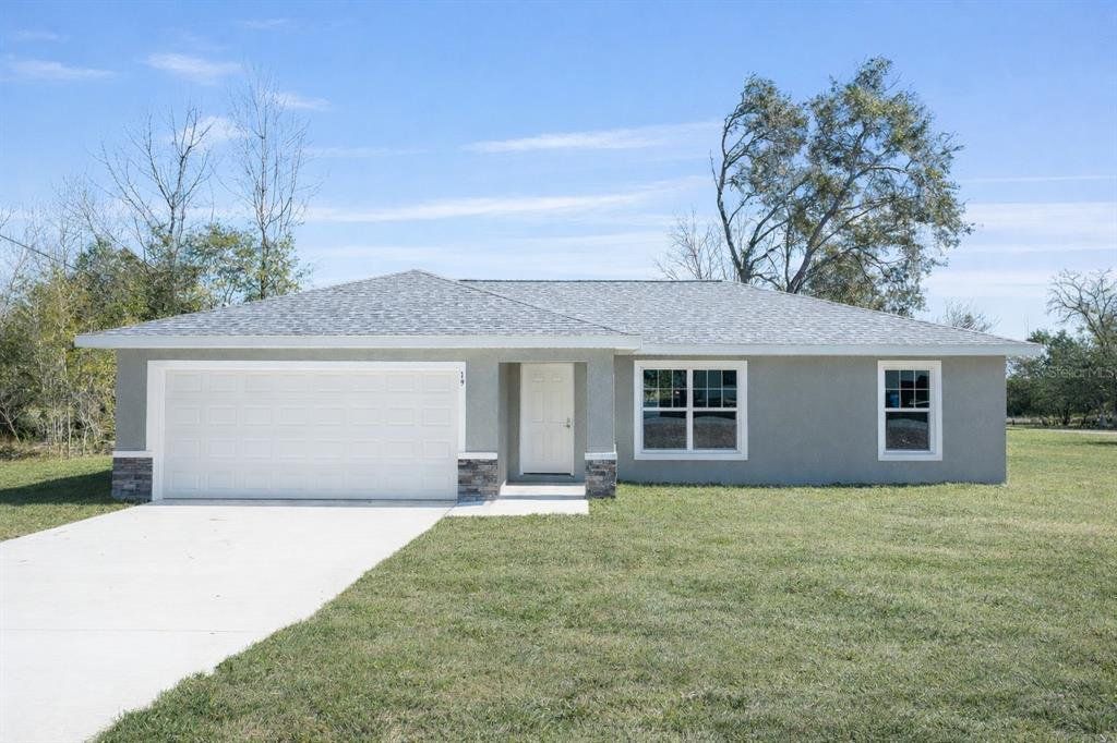 Front exterior of a new home in , Ocala, FL, highlighting curb appeal (Image 1). Front exterior of a new home in , Ocala, FL, highlighting curb appeal (Image 1).