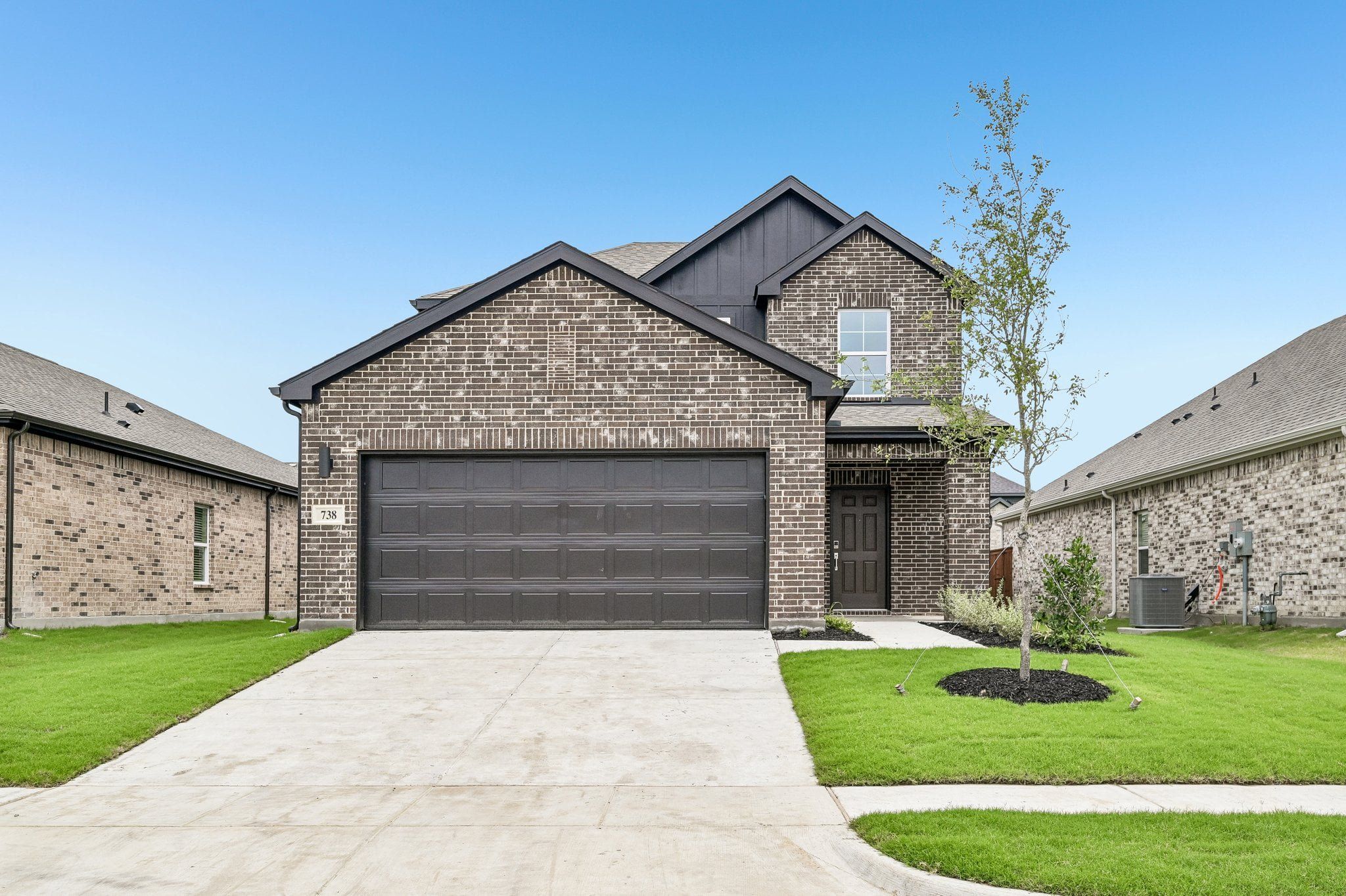 Front exterior of a new home in Overland Grove, Forney, TX, highlighting curb appeal (Image 1). Front exterior of a new home in Overland Grove, Forney, TX, highlighting curb appeal (Image 1).