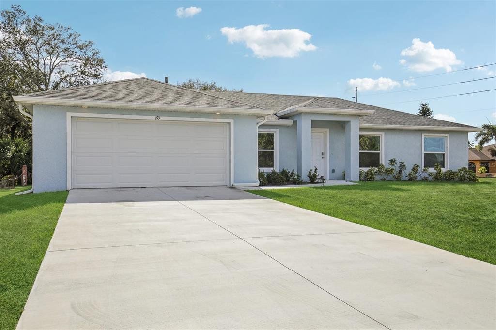 Front exterior of a new home in , Port Charlotte, FL, highlighting curb appeal (Image 1). Front exterior of a new home in , Port Charlotte, FL, highlighting curb appeal (Image 1).