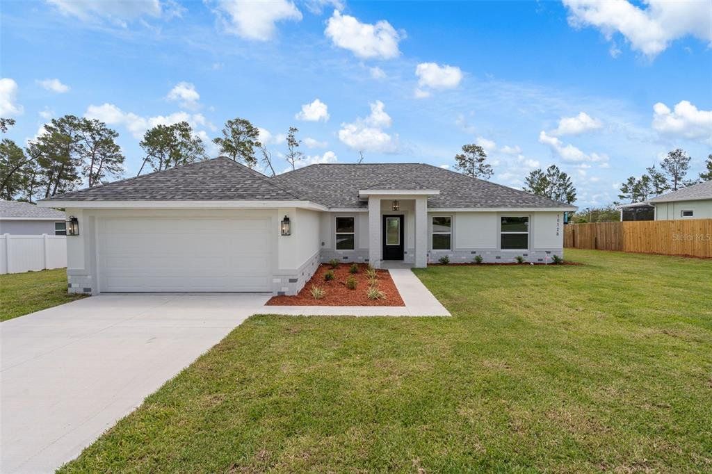 Front exterior of a new home in , Weeki Wachee, FL, highlighting curb appeal (Image 1). Front exterior of a new home in , Weeki Wachee, FL, highlighting curb appeal (Image 1).