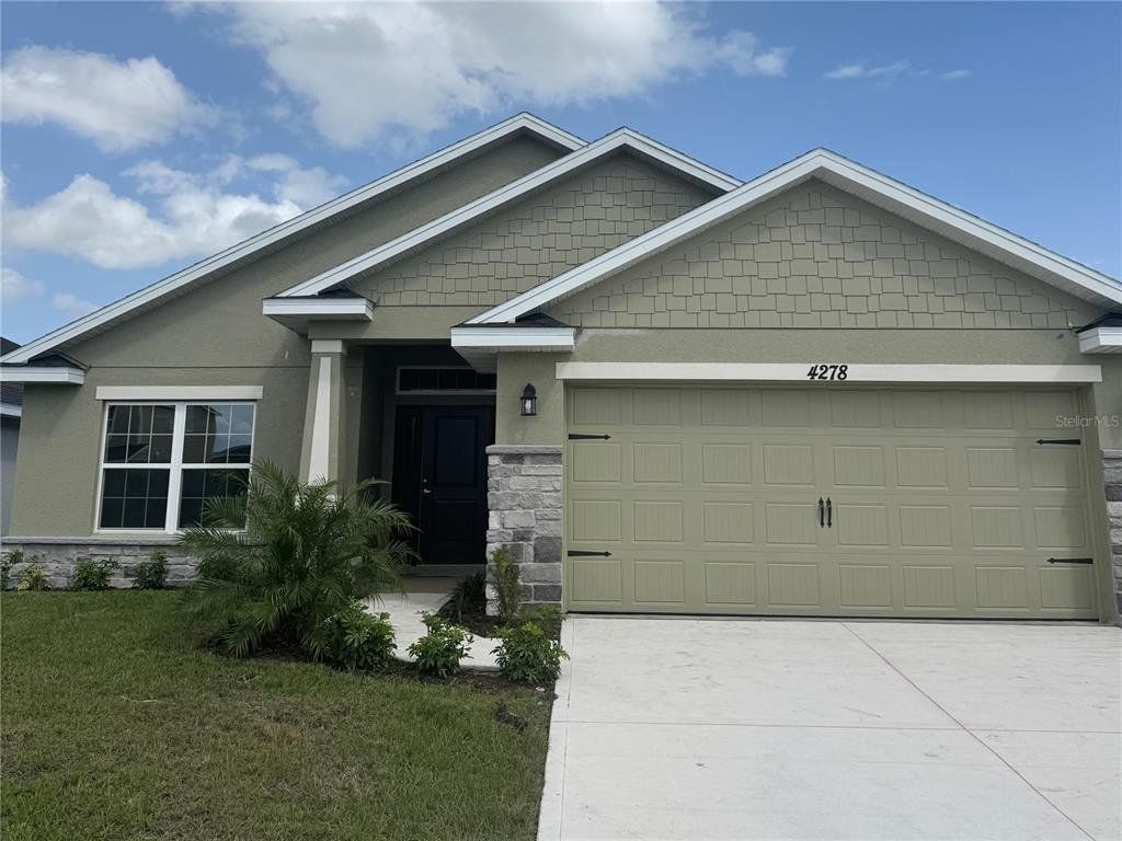 Front exterior of a new home in Harmony Central, St. Cloud, FL, highlighting curb appeal (Image 1). Front exterior of a new home in Harmony Central, St. Cloud, FL, highlighting curb appeal (Image 1).