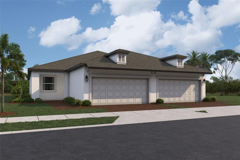Front exterior of a new home in Southpointe, Palmetto, FL, highlighting curb appeal (Image 1). Front exterior of a new home in Southpointe, Palmetto, FL, highlighting curb appeal (Image 1).