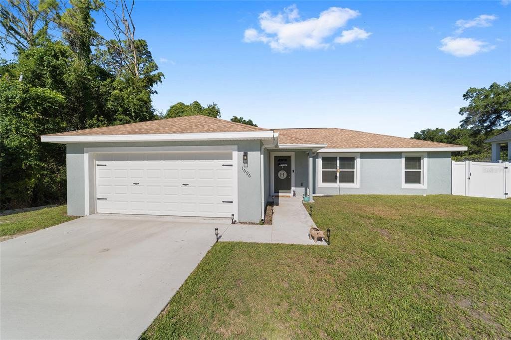 Front exterior of a new home in , Ocala, FL, highlighting curb appeal (Image 1). Front exterior of a new home in , Ocala, FL, highlighting curb appeal (Image 1).