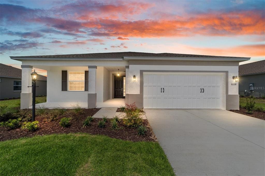 Front exterior of a new home in On Top of the World Communities, Ocala, FL, highlighting curb appeal (Image 1). Front exterior of a new home in On Top of the World Communities, Ocala, FL, highlighting curb appeal (Image 1).