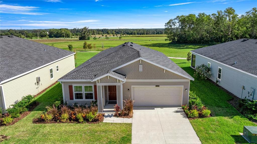Front exterior of a new home in Pioneer Ranch, Ocala, FL, highlighting curb appeal (Image 1). Front exterior of a new home in Pioneer Ranch, Ocala, FL, highlighting curb appeal (Image 1).