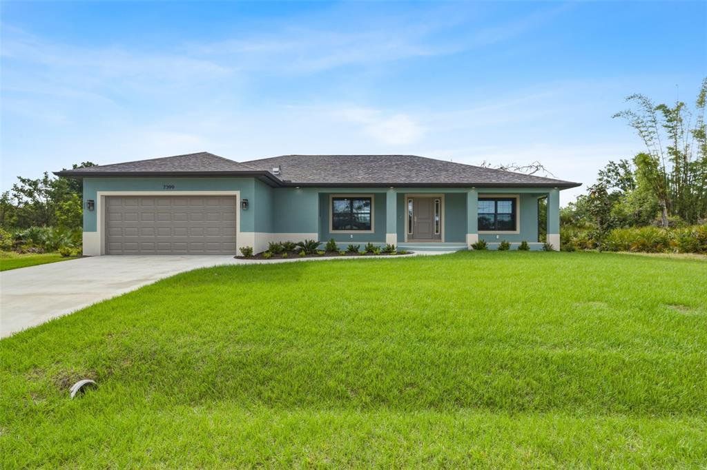 Front exterior of a new home in , Port Charlotte, FL, highlighting curb appeal (Image 1). Front exterior of a new home in , Port Charlotte, FL, highlighting curb appeal (Image 1).