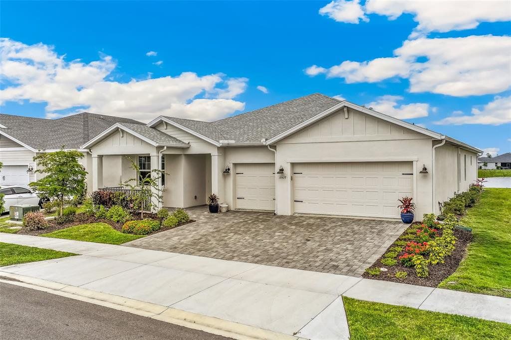 Front exterior of a new home in , Punta Gorda, FL, highlighting curb appeal (Image 1). Front exterior of a new home in , Punta Gorda, FL, highlighting curb appeal (Image 1).
