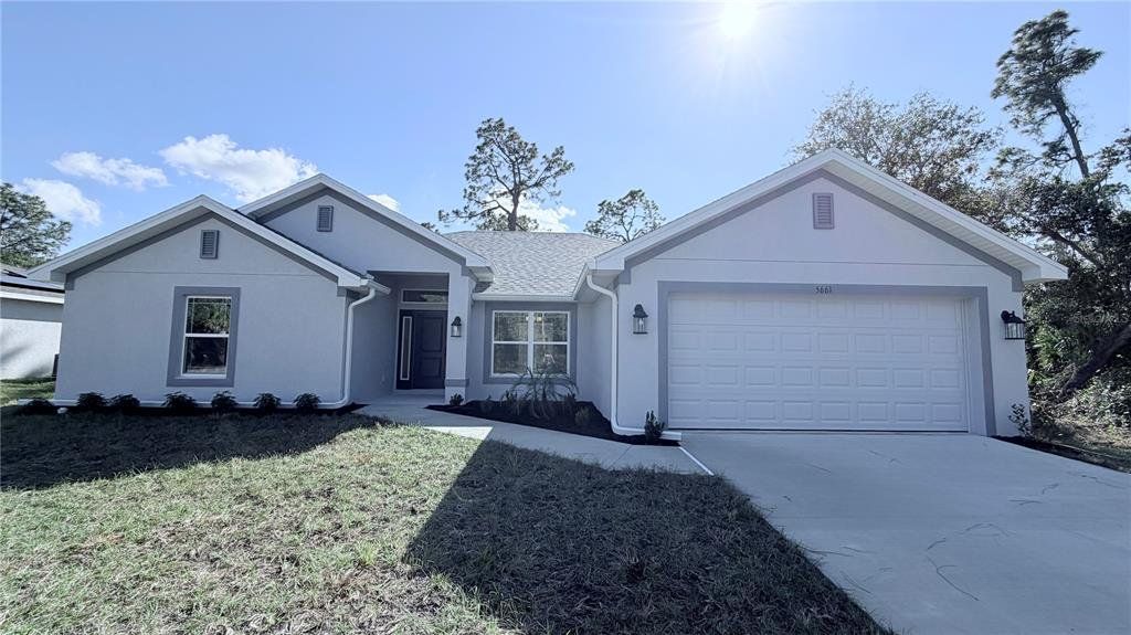 Front exterior of a new home in North Port, North Port, FL, highlighting curb appeal (Image 1). Front exterior of a new home in North Port, North Port, FL, highlighting curb appeal (Image 1).