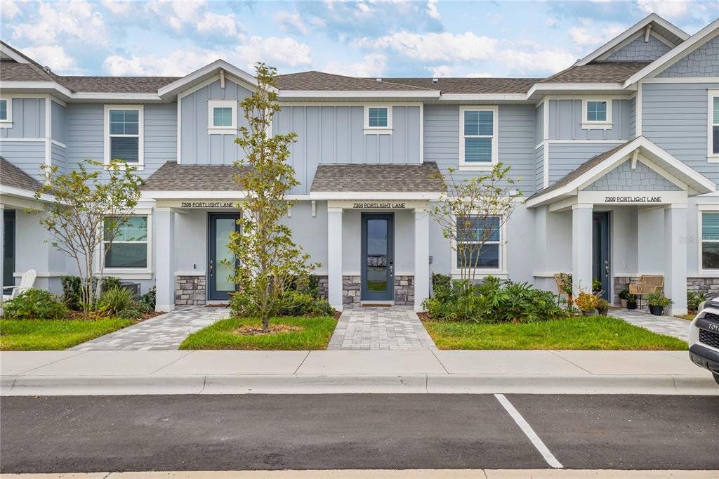 Front exterior of a new home in , Sarasota, FL, highlighting curb appeal (Image 1). Front exterior of a new home in , Sarasota, FL, highlighting curb appeal (Image 1).