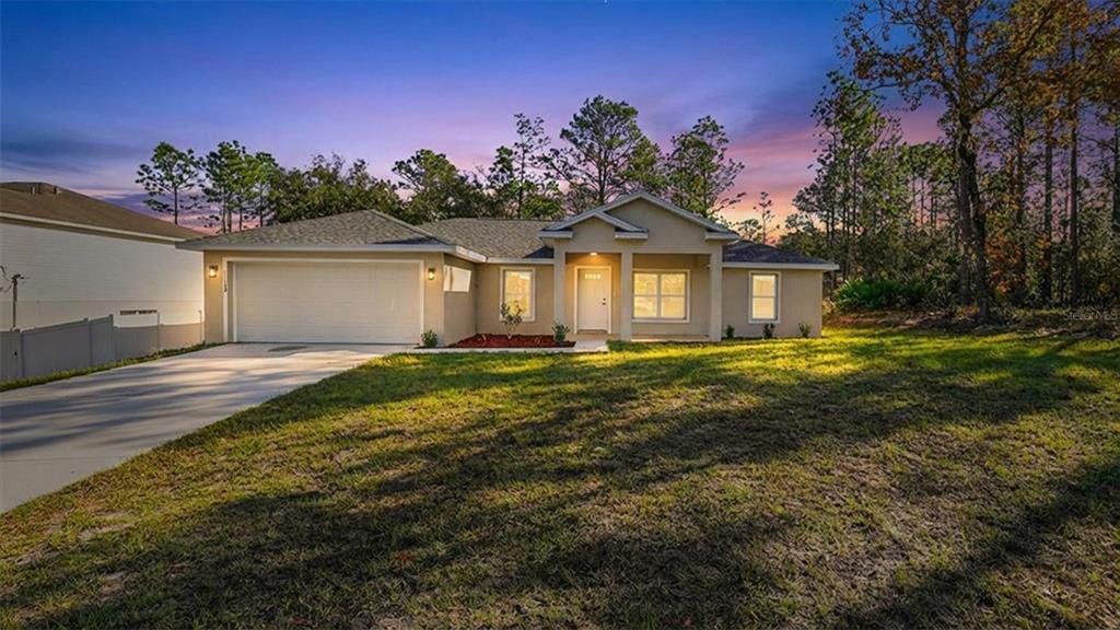 Front exterior of a new home in , Citrus Springs, FL, highlighting curb appeal (Image 1). Front exterior of a new home in , Citrus Springs, FL, highlighting curb appeal (Image 1).