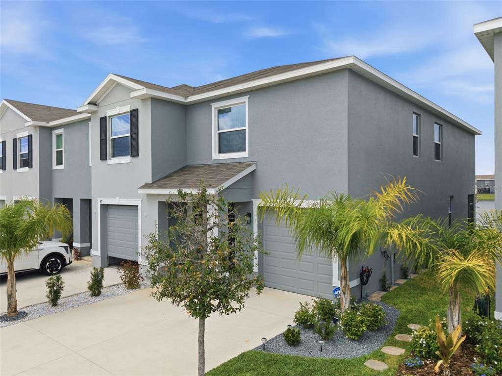 Front exterior of a new home in , Apollo Beach, FL, highlighting curb appeal (Image 1). Front exterior of a new home in , Apollo Beach, FL, highlighting curb appeal (Image 1).