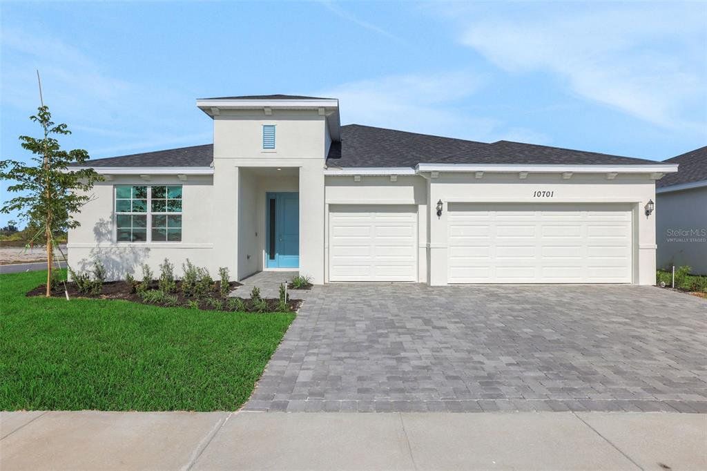 Front exterior of a new home in Brystol North at Wylder, Port St. Lucie, FL, highlighting curb appeal (Image 1). Front exterior of a new home in Brystol North at Wylder, Port St. Lucie, FL, highlighting curb appeal (Image 1).