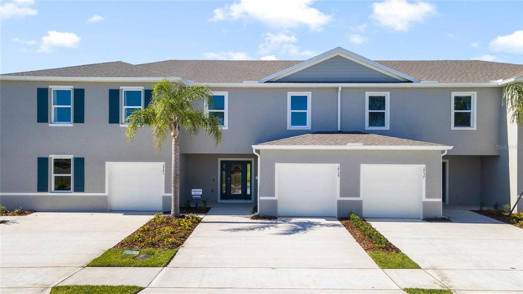 Front exterior of a new home in Rivers Edge, Edgewater, FL, highlighting curb appeal (Image 1). Front exterior of a new home in Rivers Edge, Edgewater, FL, highlighting curb appeal (Image 1).