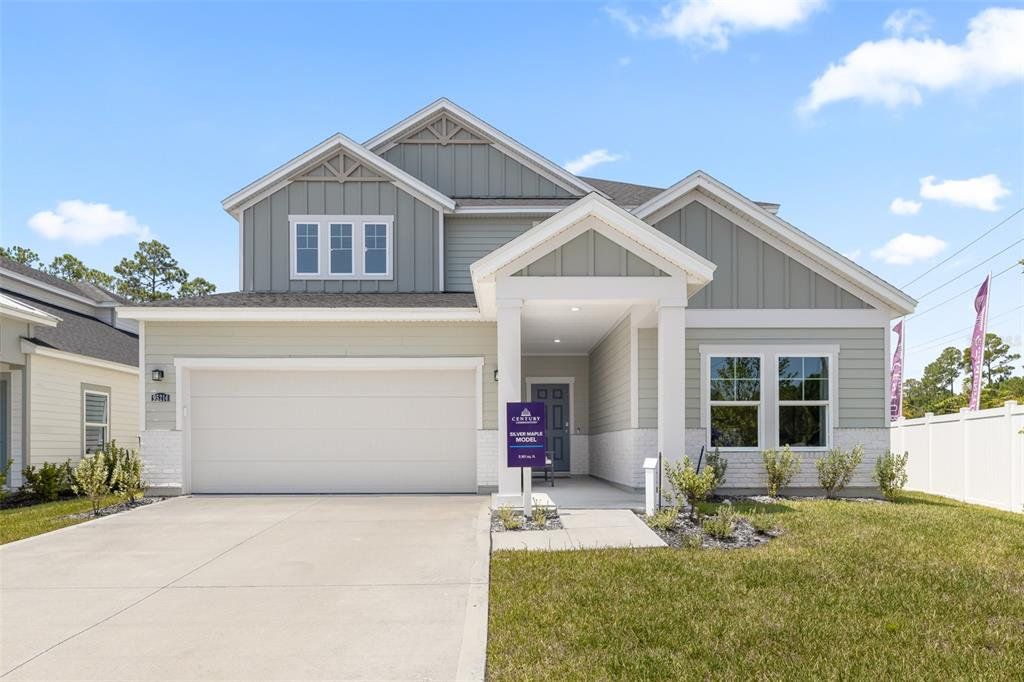 Front exterior of a new home in Seminole Palms, Palm Coast, FL, highlighting curb appeal (Image 1). Front exterior of a new home in Seminole Palms, Palm Coast, FL, highlighting curb appeal (Image 1).