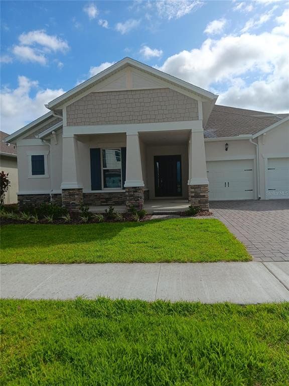 Front exterior of a new home in , Orlando, FL, highlighting curb appeal (Image 1). Front exterior of a new home in , Orlando, FL, highlighting curb appeal (Image 1).