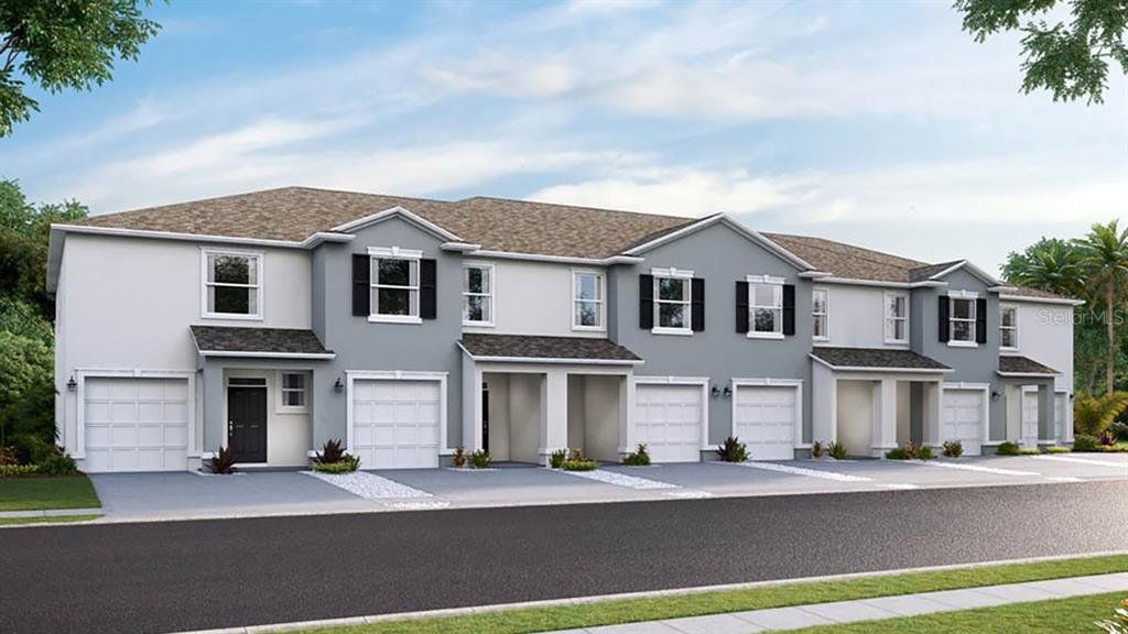 Front exterior of a new home in Star Farms at Lakewood Ranch, Bradenton, FL, highlighting curb appeal (Image 1).