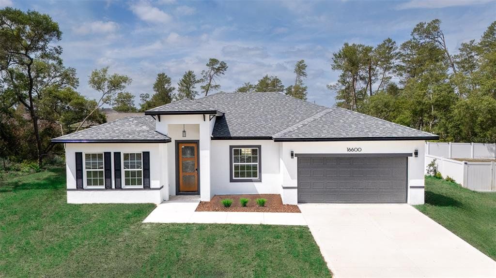 Front exterior of a new home in , Ocala, FL, highlighting curb appeal (Image 1). Front exterior of a new home in , Ocala, FL, highlighting curb appeal (Image 1).