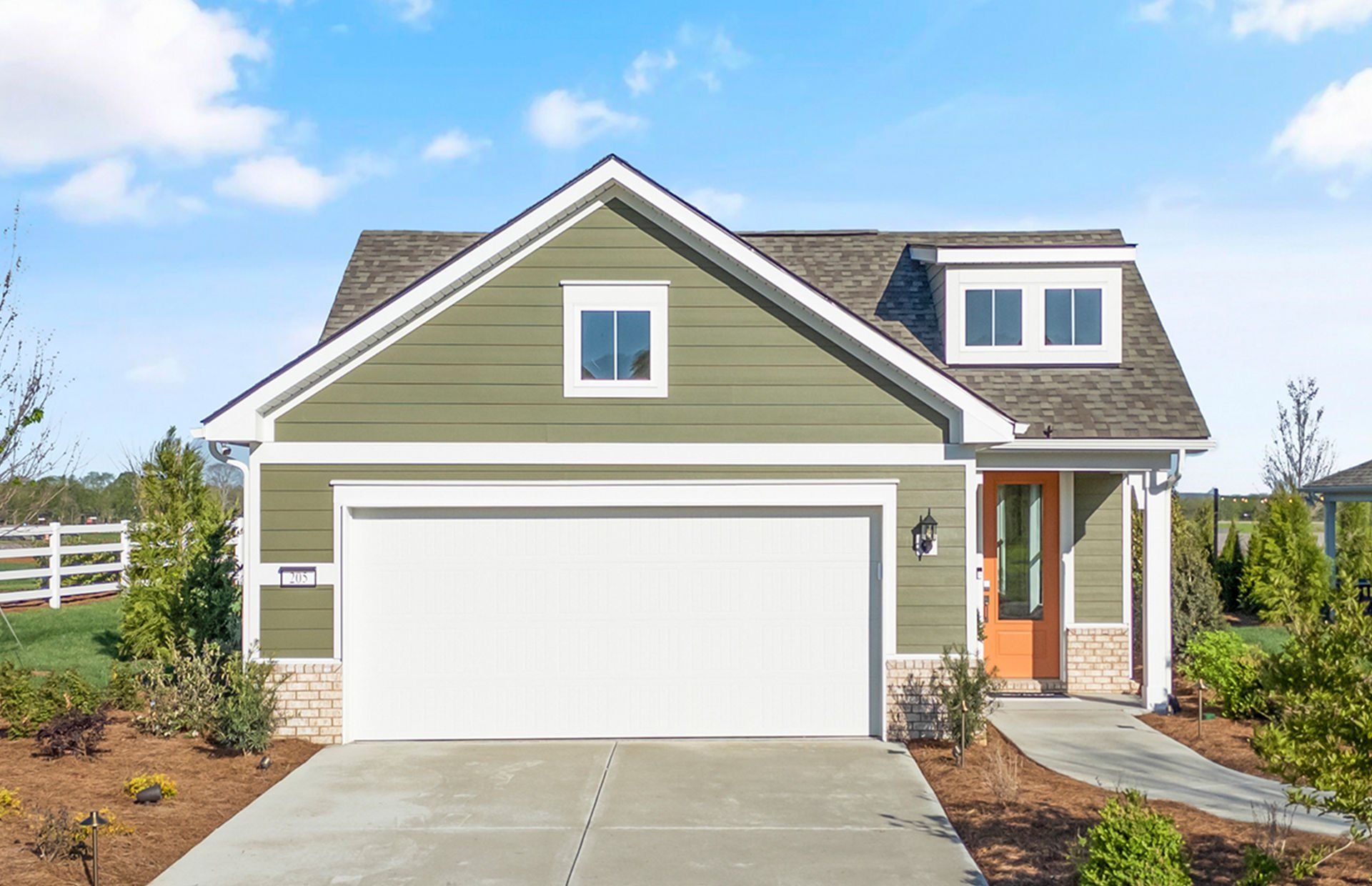 Front exterior of a new home in Del Webb Southern Harmony, Murfreesboro, TN, highlighting curb appeal (Image 1). Front exterior of a new home in Del Webb Southern Harmony, Murfreesboro, TN, highlighting curb appeal (Image 1).