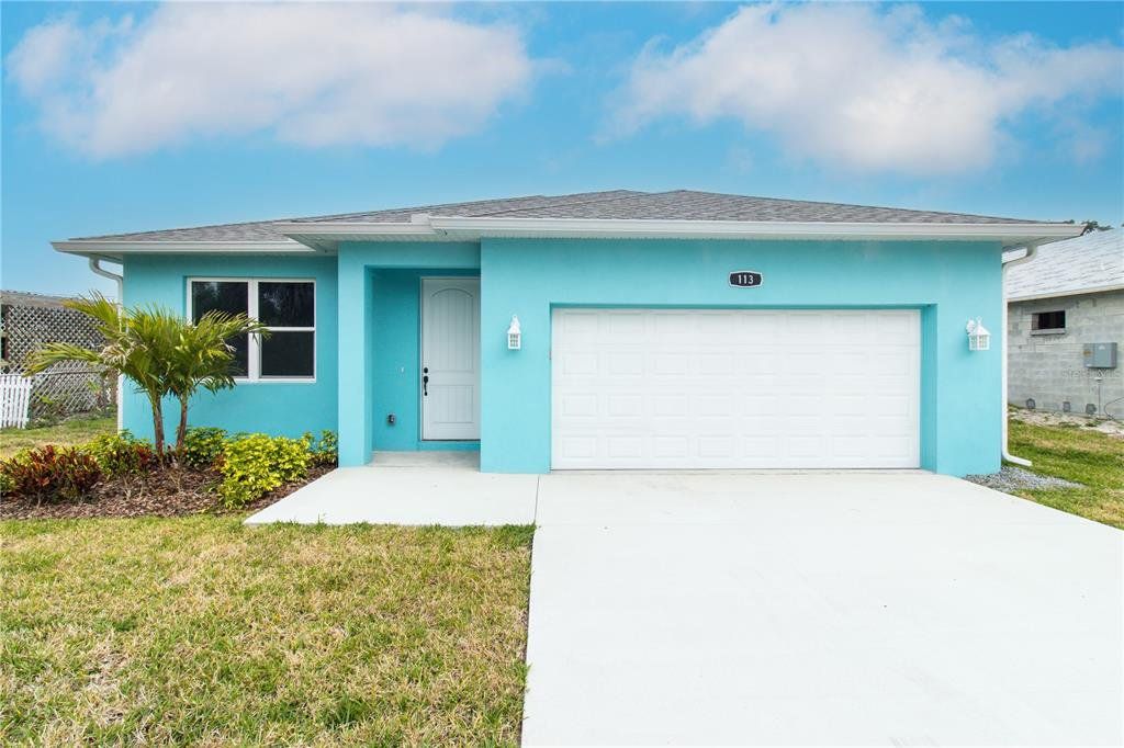 Front exterior of a new home in , Edgewater, FL, highlighting curb appeal (Image 1). Front exterior of a new home in , Edgewater, FL, highlighting curb appeal (Image 1).