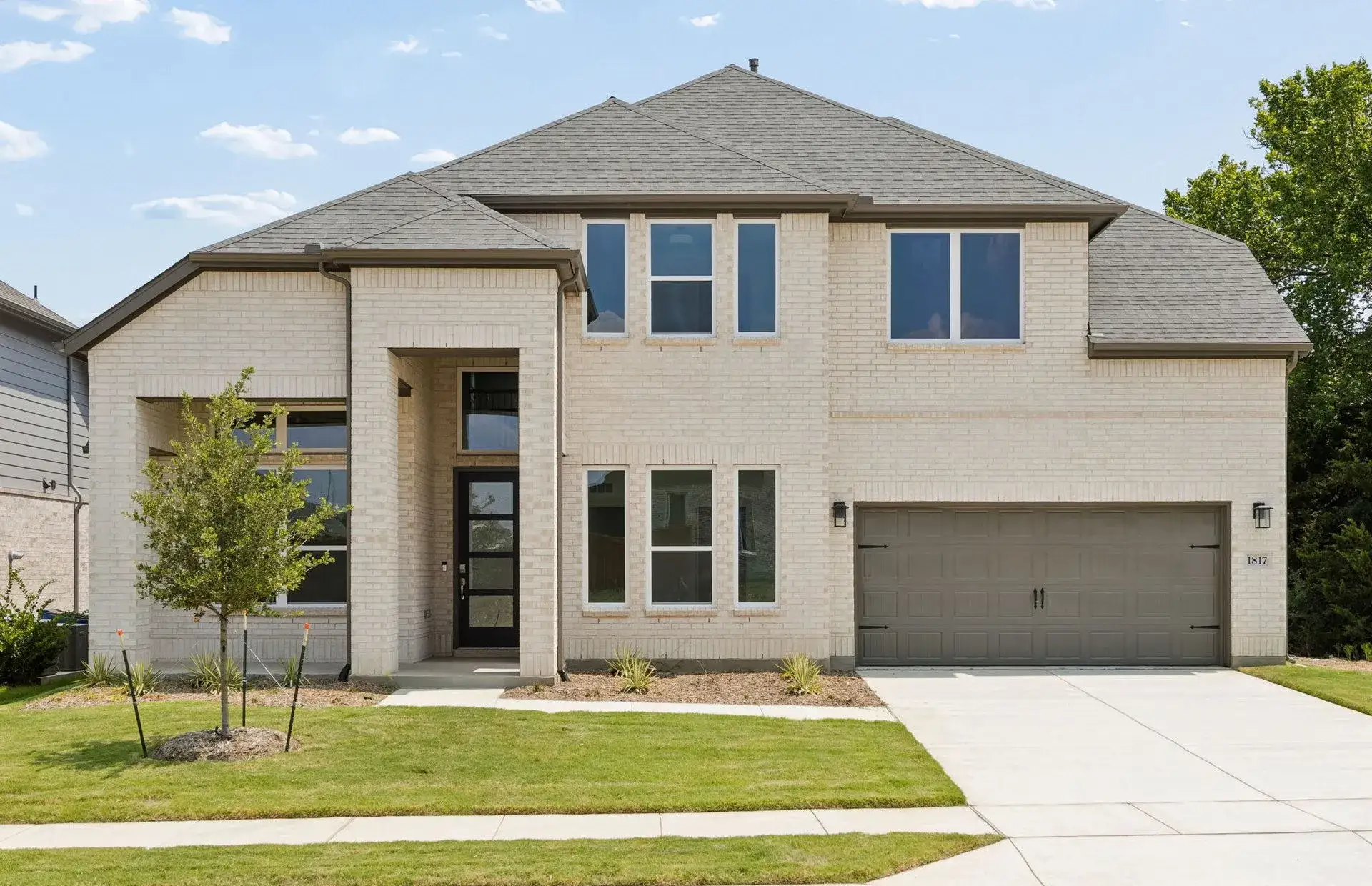 Front exterior of a new home in Wilson Creek Meadows, Celina, TX, highlighting curb appeal (Image 1). Front exterior of a new home in Wilson Creek Meadows, Celina, TX, highlighting curb appeal (Image 1).