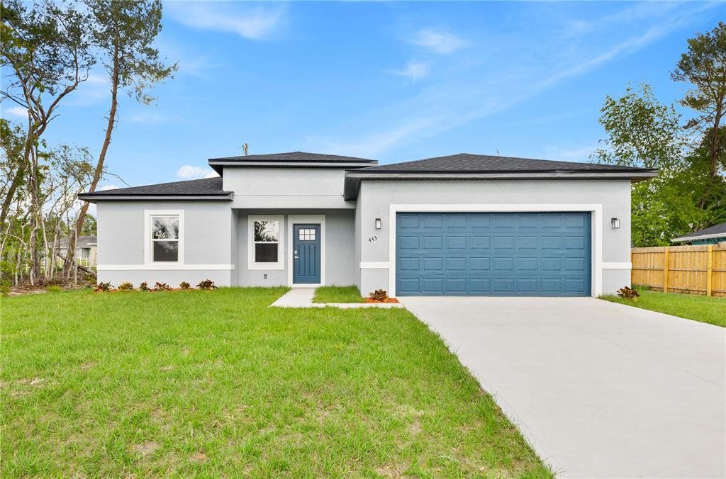 Front exterior of a new home in , Ocala, FL, highlighting curb appeal (Image 1).