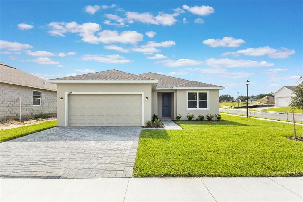 Front exterior of a new home in Grand Isle, Grand Island, FL, highlighting curb appeal (Image 1). Front exterior of a new home in Grand Isle, Grand Island, FL, highlighting curb appeal (Image 1).