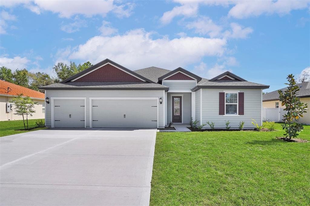 Front exterior of a new home in Palm Coast, Palm Coast, FL, highlighting curb appeal (Image 1). Front exterior of a new home in Palm Coast, Palm Coast, FL, highlighting curb appeal (Image 1).