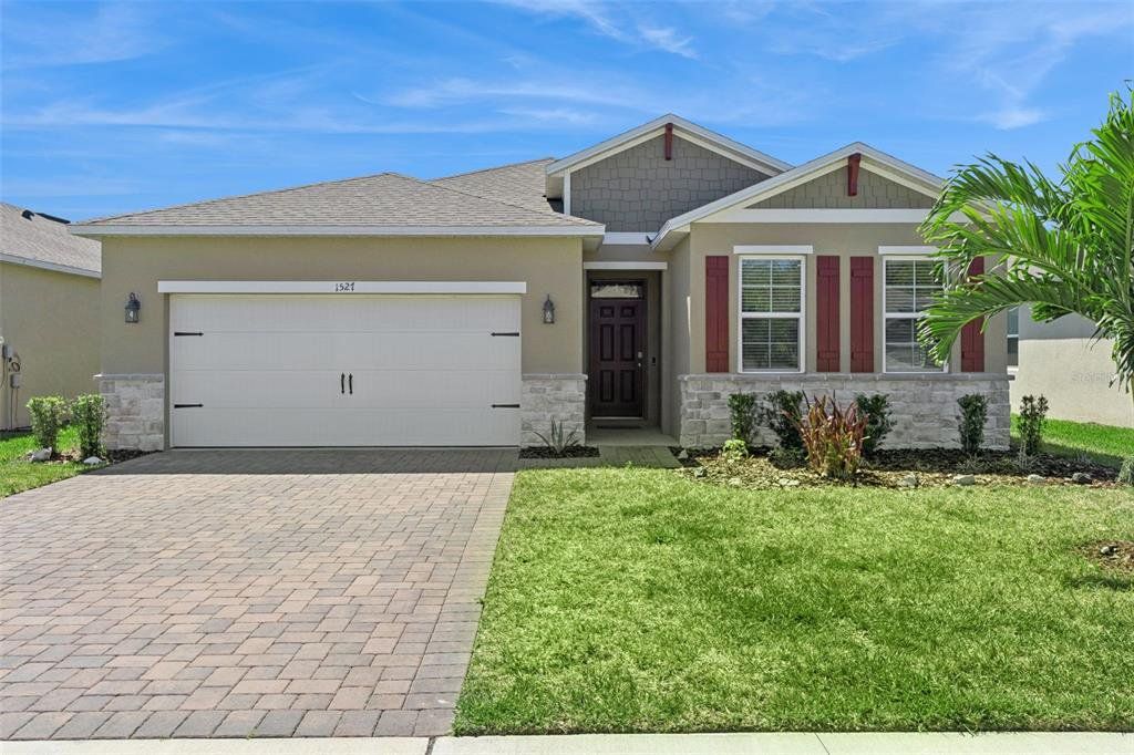 Front exterior of a new home in , New Smyrna Beach, FL, highlighting curb appeal (Image 1). Front exterior of a new home in , New Smyrna Beach, FL, highlighting curb appeal (Image 1).