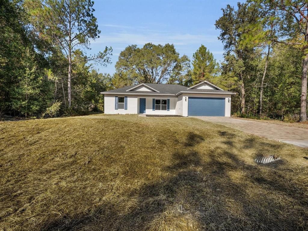 Front exterior of a new home in , Ocklawaha, FL, highlighting curb appeal (Image 1). Front exterior of a new home in , Ocklawaha, FL, highlighting curb appeal (Image 1).