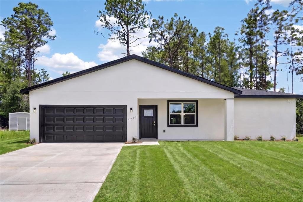 Front exterior of a new home in , Citrus Springs, FL, highlighting curb appeal (Image 1). Front exterior of a new home in , Citrus Springs, FL, highlighting curb appeal (Image 1).