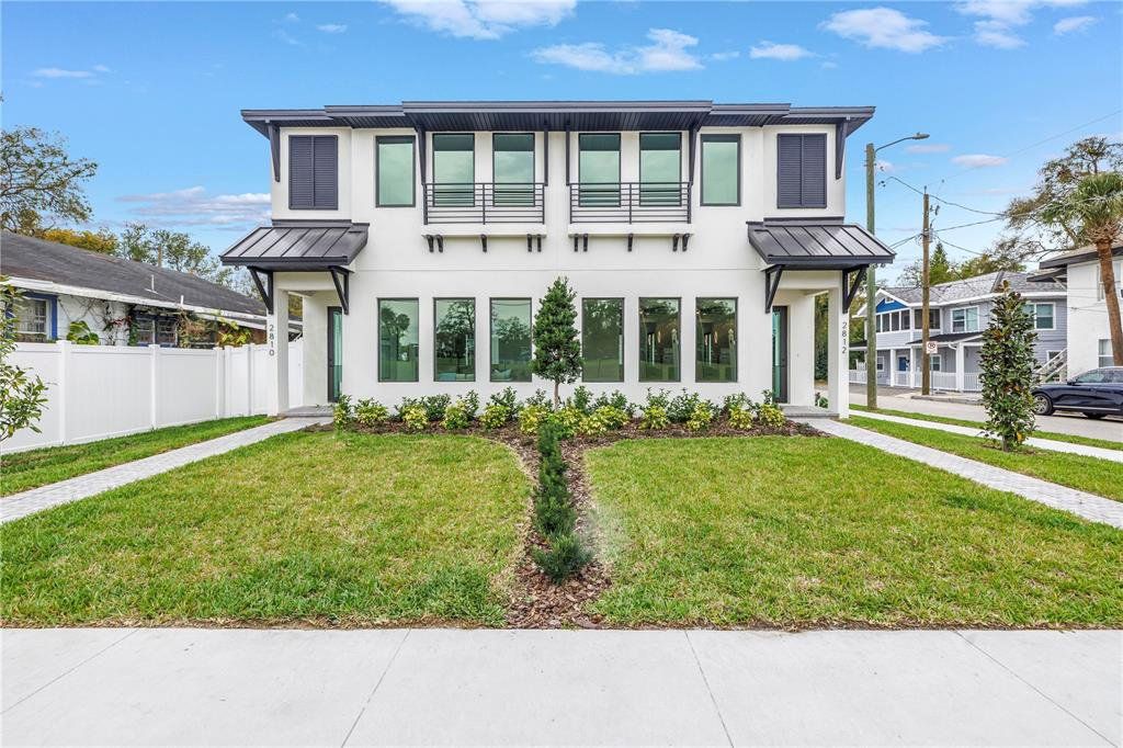 Front exterior of a new home in , Tampa, FL, highlighting curb appeal (Image 1). Front exterior of a new home in , Tampa, FL, highlighting curb appeal (Image 1).