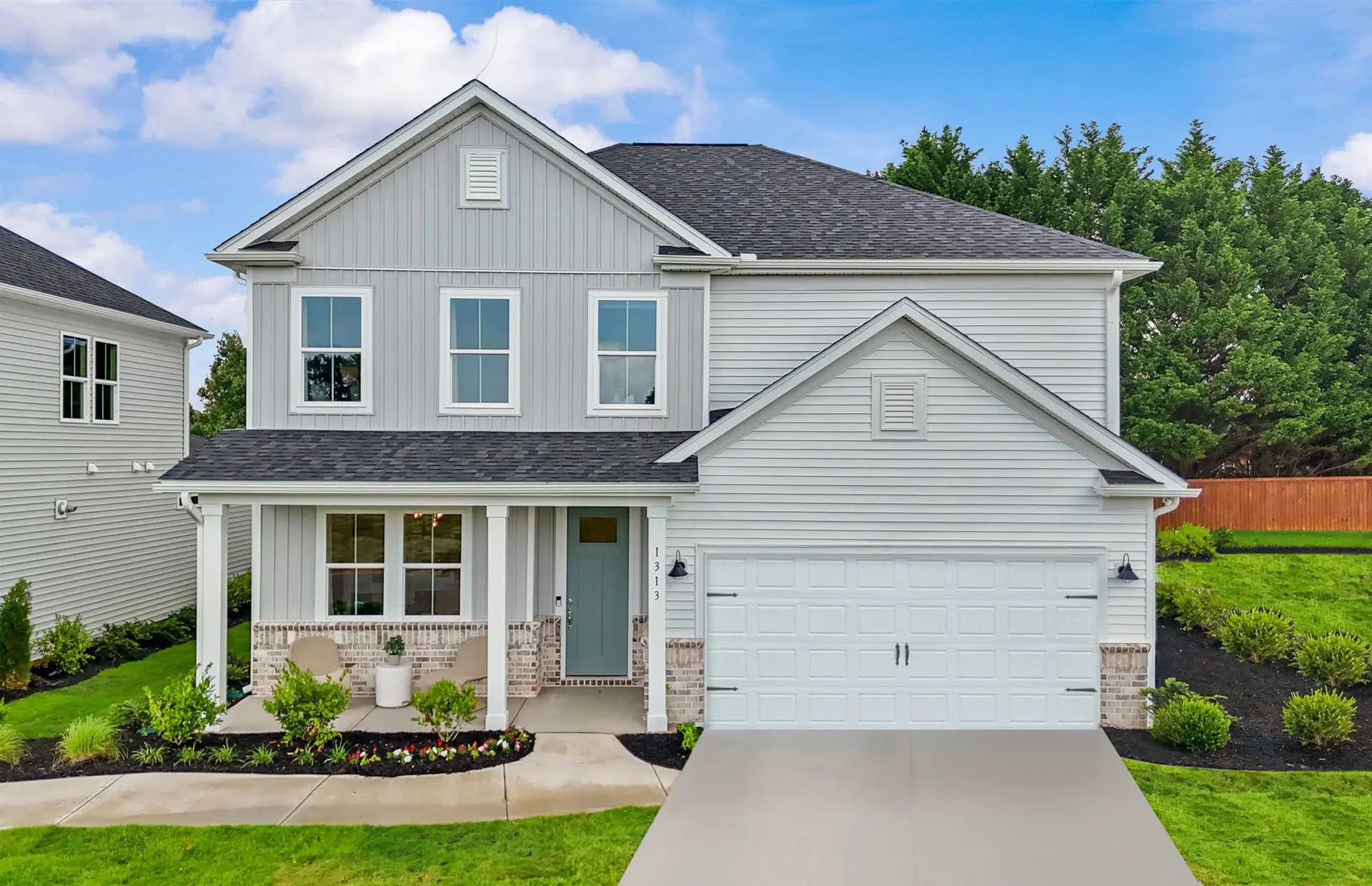 Front exterior of a new home in Fox Hollow, Spartanburg, SC, highlighting curb appeal (Image 1). Front exterior of a new home in Fox Hollow, Spartanburg, SC, highlighting curb appeal (Image 1).
